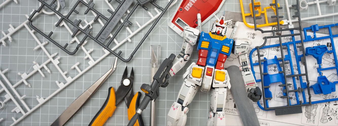 A Gunpla model kit with the runners around